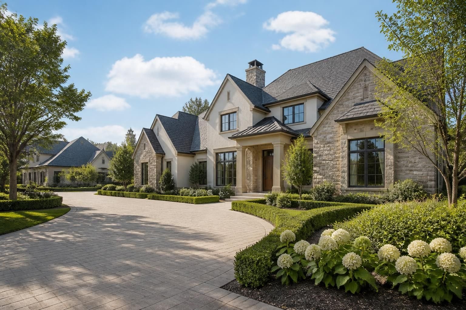 Luxury residential homes with manicured grounds and open skies.